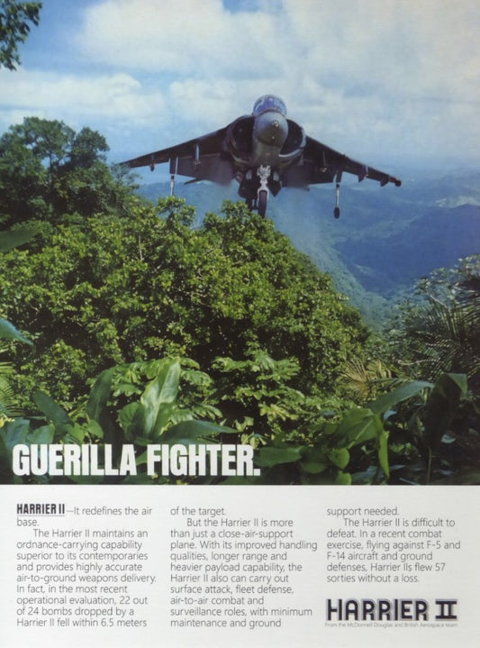 A high-quality poster from Warfare Media depicts an AV-8B HARRIER 2 "Guerrilla Fighter" hovering above a dense jungle. The text highlights its advanced features, including accurate ordnance delivery and its capability to support operations in challenging environments.